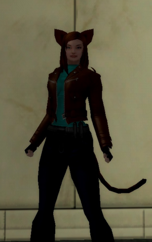 Brown hair catgril wearing jeans and a brown leather biker's jacket.